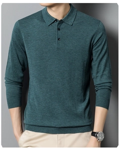 Detail of dark green knit polo sweater showing three-button neckline and ribbed textures