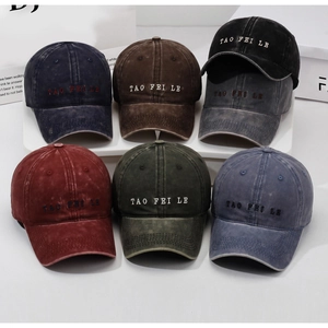 Six colors of vintage washed cotton baseball caps with embroidered letters on display