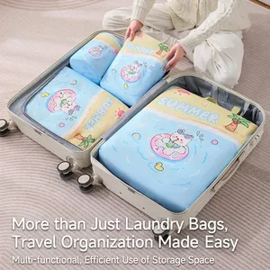 Set of mesh laundry bags with swimming cat prints organized in a suitcase for travel