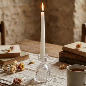 Vintage ribbed glass skirt candle holder with a white taper candle for romantic home decor