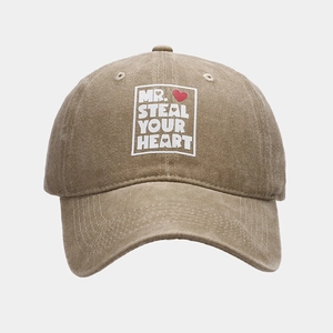 Close-up of khaki washed cotton baseball cap with MR. STEAL YOUR HEART print design