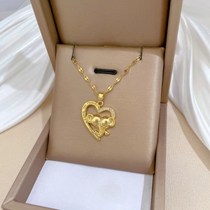 Golden elephant heart necklace with Love You Forever engraving in beige jewelry box