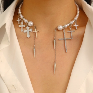 Multilayer pearl necklace featuring crystal cross pendants and metallic cone charms