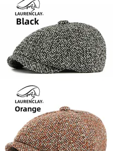 Dettaglio ravvicinato di cappelli newsboy in tweed testurizzato, grigio nero e rosso arancio