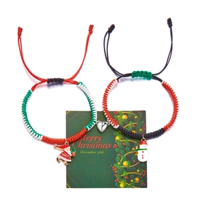 Detail of Christmas braided bracelets with Santa and Snowman charms and magnetic heart