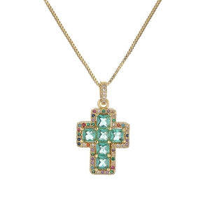 Gold cross necklace featuring a large turquoise stone and colorful zircon accents