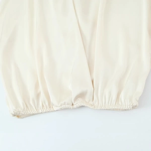 Fashionable satin silk blouse for women featuring elastic cuffs and pearl white sheen