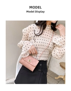Pink quilted leather crossbody bag featuring a golden metal twist lock and shoulder strap