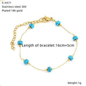 Detail of 18K gold-plated stainless steel bracelet with blue turquoise cube beads