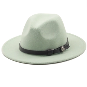 Detail of mint green wool fedora hat featuring a thin black leather band and floral buckle
