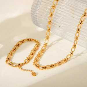 Detail of 18K gold-plated stainless steel chain necklace with S.Steel hallmark tag