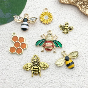 DIY enamel bee and honeycomb charm set in gold finish for jewelry making projects