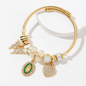 Gold braided bracelet with butterfly, virgin mary medal and crystal heart charms