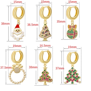Detail view of various festive Christmas earrings with sizes like Santa and Xmas trees