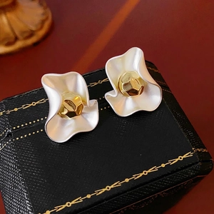Elegant gold-plated petal stud earrings with matte white finish and center metal bead