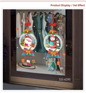 Christmas window decals set featuring Santa Claus and snowman on a glass window pane