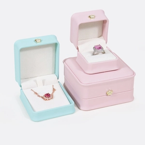 Pink and blue jewelry gift boxes with gold crown accents for rings and necklaces