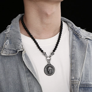 Men's retro skull pendant necklace featuring black agate beads and silver steel medallion