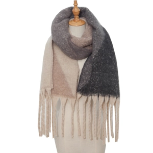 Close-up of thick beige and khaki jacquard mohair-style scarf with chunky fringes