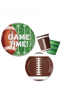 Detail of football party paper plates and cups with Game Time and field patterns
