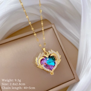 Detailed view of gold winged heart necklace with colorful stones and product dimensions