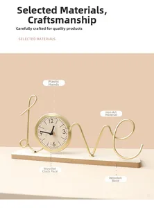 Detailed view of creative golden iron clock with love letters and wooden base
