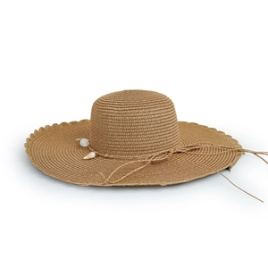 Detailed view of wide brim straw sun hat featuring wavy edges and shell decorations