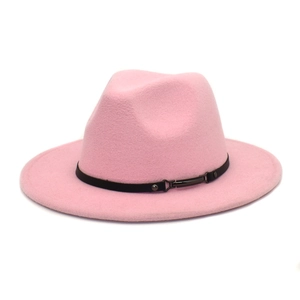 Detail of pink wool fedora hat featuring a black leather band and metal buckle accent