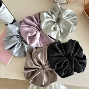 Oversized satin scrunchies set in 5 colors featuring elegant silk sheen and fashion label