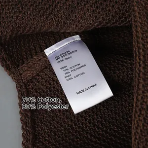 Detailed view of the 58cm knit hat care label showing cotton and polyester blend fabric