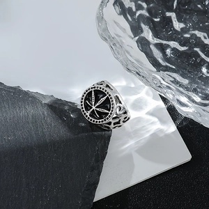 Retro silver maple leaf ring with black enamel finish on professional stone display
