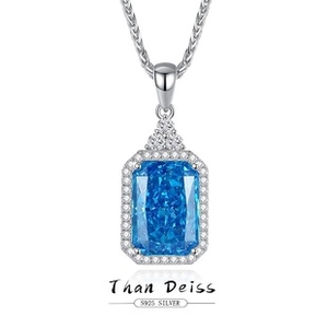 Macro detail of S925 silver necklace with rectangular blue gemstone in emerald cut