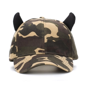 Detail shot of camo baseball cap featuring unique black devil horns and classic six-panel structure