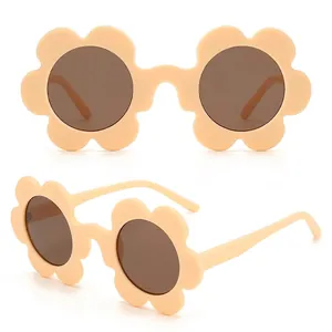 Flower shaped women sunglasses with six petal frames and dark round lenses in cream yellow