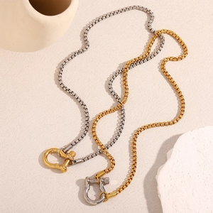 Detail of stainless steel box chain necklaces with gold and silver shackle clasps
