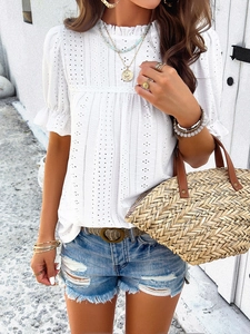 Detailed view of white hollow-out embroidery and ruffled sleeves on women's casual T-shirt