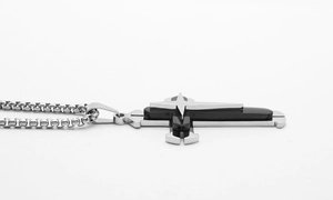 Detailed side view of the triple-layered stainless steel cross pendant with black inlay