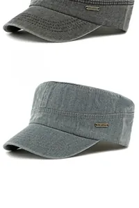 Detail of grey washed cotton flat top military cap featuring a metal logo plate