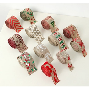 Detail view of burlap texture Christmas ribbons with reindeer and tree patterns