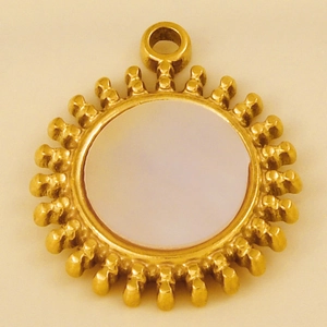 Detailed macro view of gold sun pendant with white shell inlay and 304 stainless steel frame