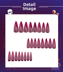 Detail view of 24pcs long stiletto press-on nails with purple cat-eye and spider web patterns