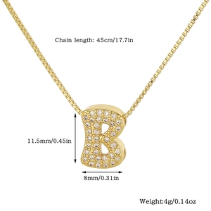Macro view of gold letter B pendant with zircon pavé setting and box chain specs