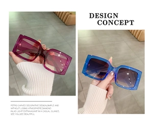 Detail view of square oversized sunglasses with purple and blue gradient resin frames