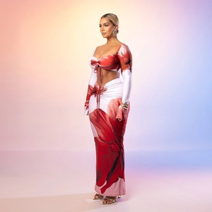 Detailed view of red and white floral two-piece skirt set with tie-front crop top