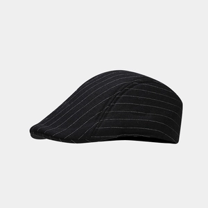 Detail of British style beret featuring white horizontal stripes on high-density black fabric