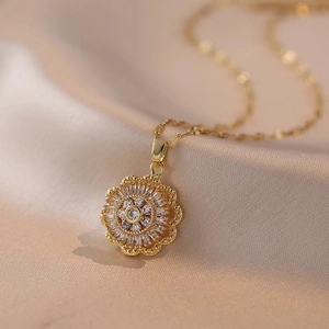 Golden titanium steel necklace with a circular flower pendant set with clear zircons