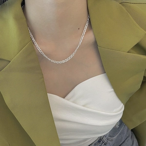 925 sterling silver pig nose anchor link necklace worn by a model in a stylish suit