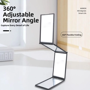 Detail showing the 360-degree adjustable 3-way folding mirror in a black frame