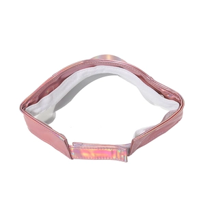 Detail view of pink holographic sun visor featuring adjustable strap and white sweatband