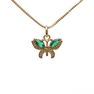 Golden butterfly necklace with green zircon crystals on a minimalist thin metal chain